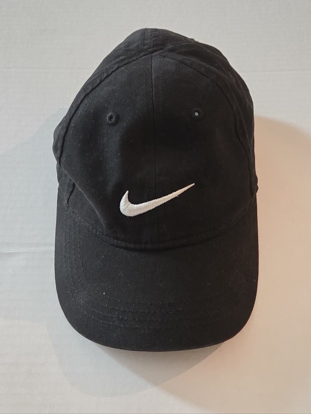Nike Black Cap with White Swoosh Logo